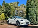 Tesla Model Y Performance, Full Self Driving Upgrade, Premium White Interior, Immersive Sound System, 21in Performance Wheels, Tow Package